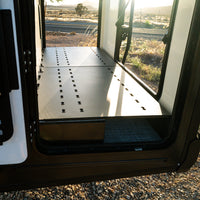 canyon ekko garage platform installed in winnebago ekko mercedes sprinter van for storage shows with doors open