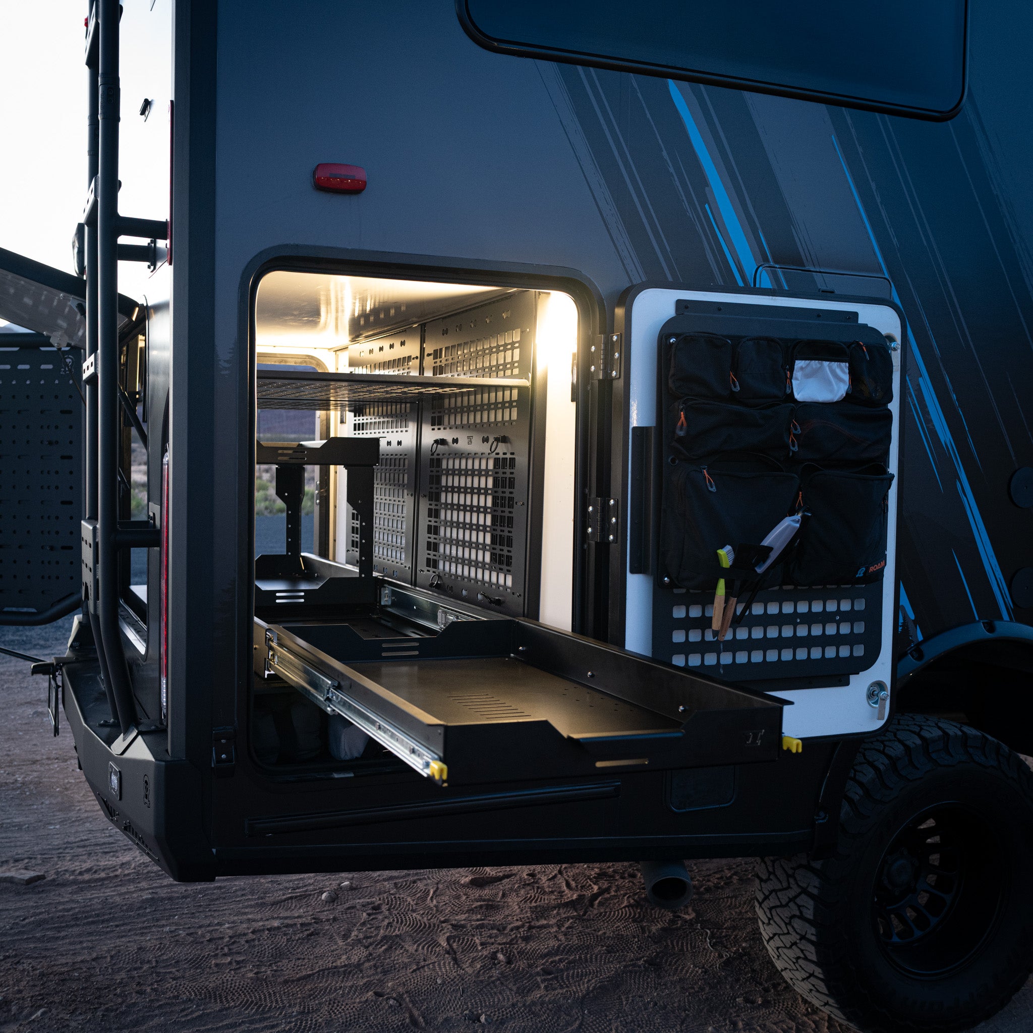 sprinter ekko cargo tray system pro slide on ekko garage platform showing molle panel wall and shelf