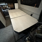 Groove Lounge Mattress Topper by Storyteller laid flat inside a van lounge area