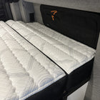 ULTRA Luxe Mattress by Storyteller Overland inside a van with quilted detailing and black trim