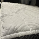 Close-up of Storyteller Overland ULTRA Luxe mattress inside a van, showing quilted texture and thick padding.