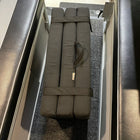 Folded Revel floor mattress with handle stored between van benches